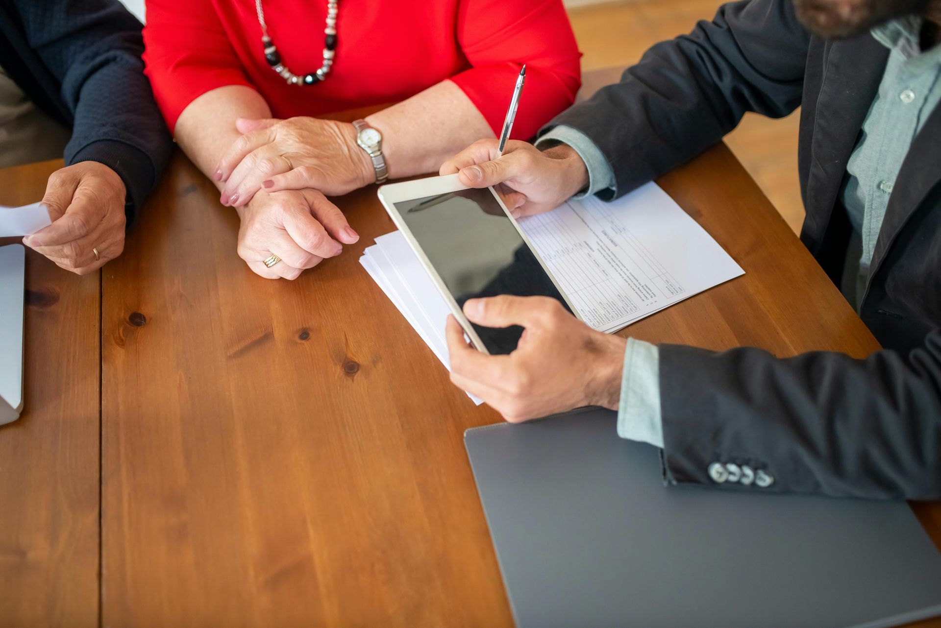 Professional Services consultant with a client in red blouse.