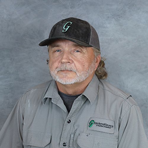 Man wearing a baseball cap with a 