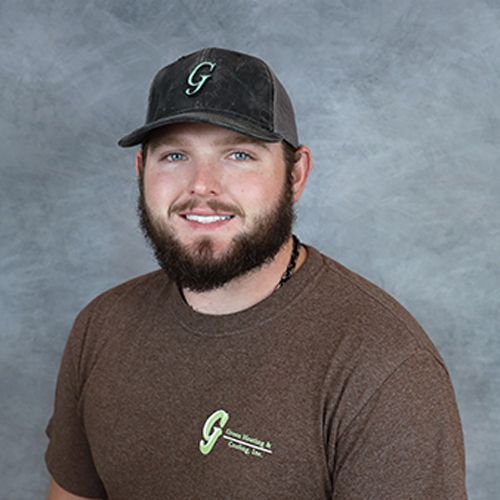 Man wearing a baseball cap with a 