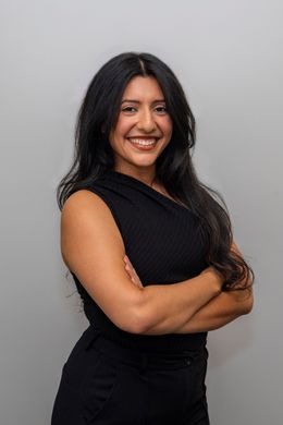 A pregnant woman with a heart in her breast on a green background.