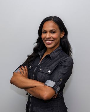 A white icon of a building with columns in a circle on an orange background.
