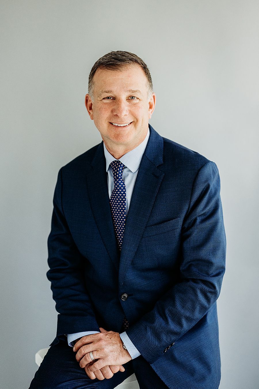 Rhode island department of health logo on a blue background