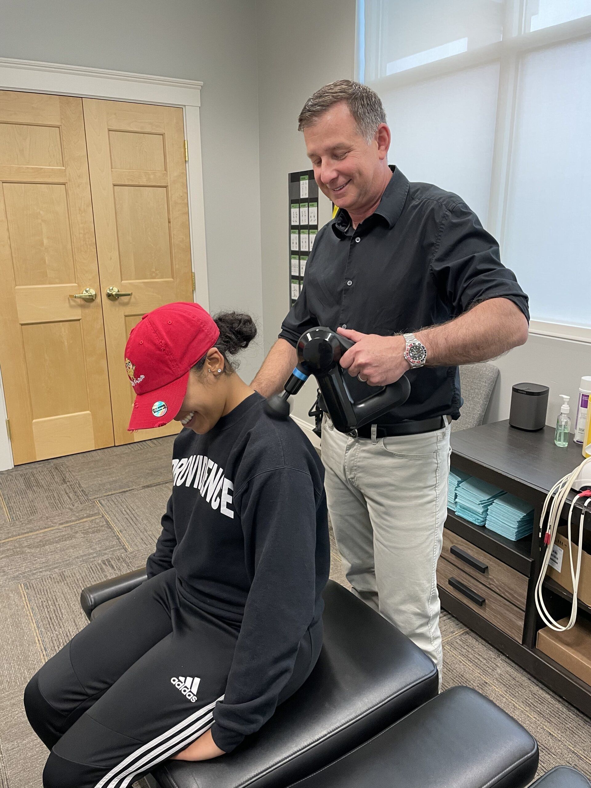 Dr. Estner treating patient with neck pains