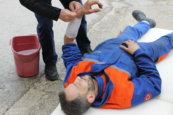 man on floor hurt because of a work related injury in RI
