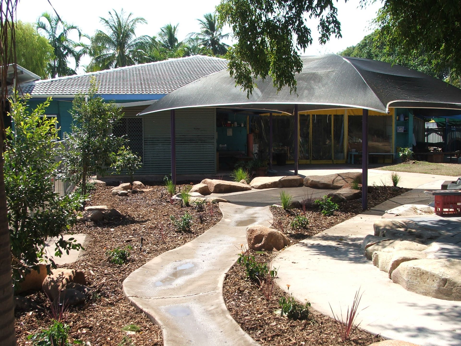 A house with a covered walkway leading to it