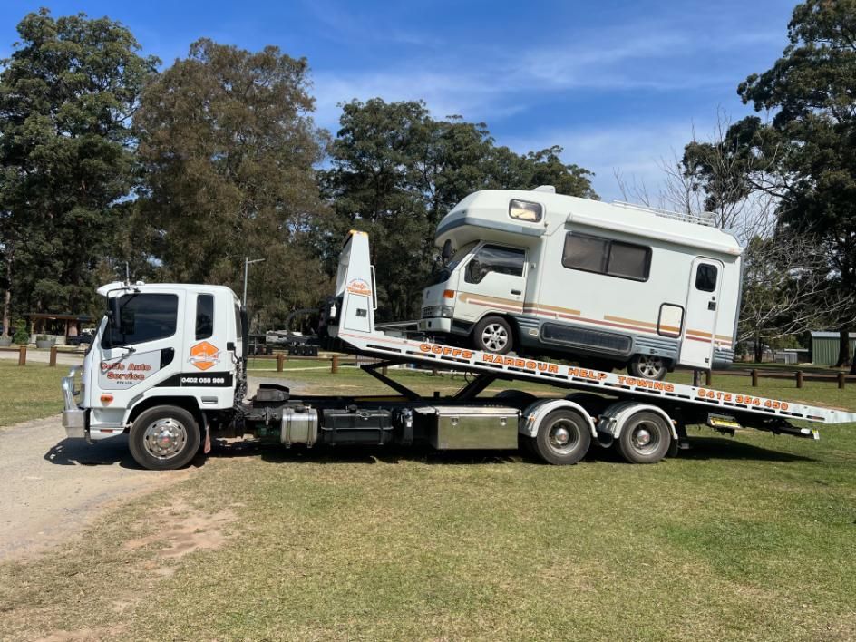 A Rv is Being Towed by a Tow Truck — Coffs Tow Trucks In Nambucca Heads, NSW