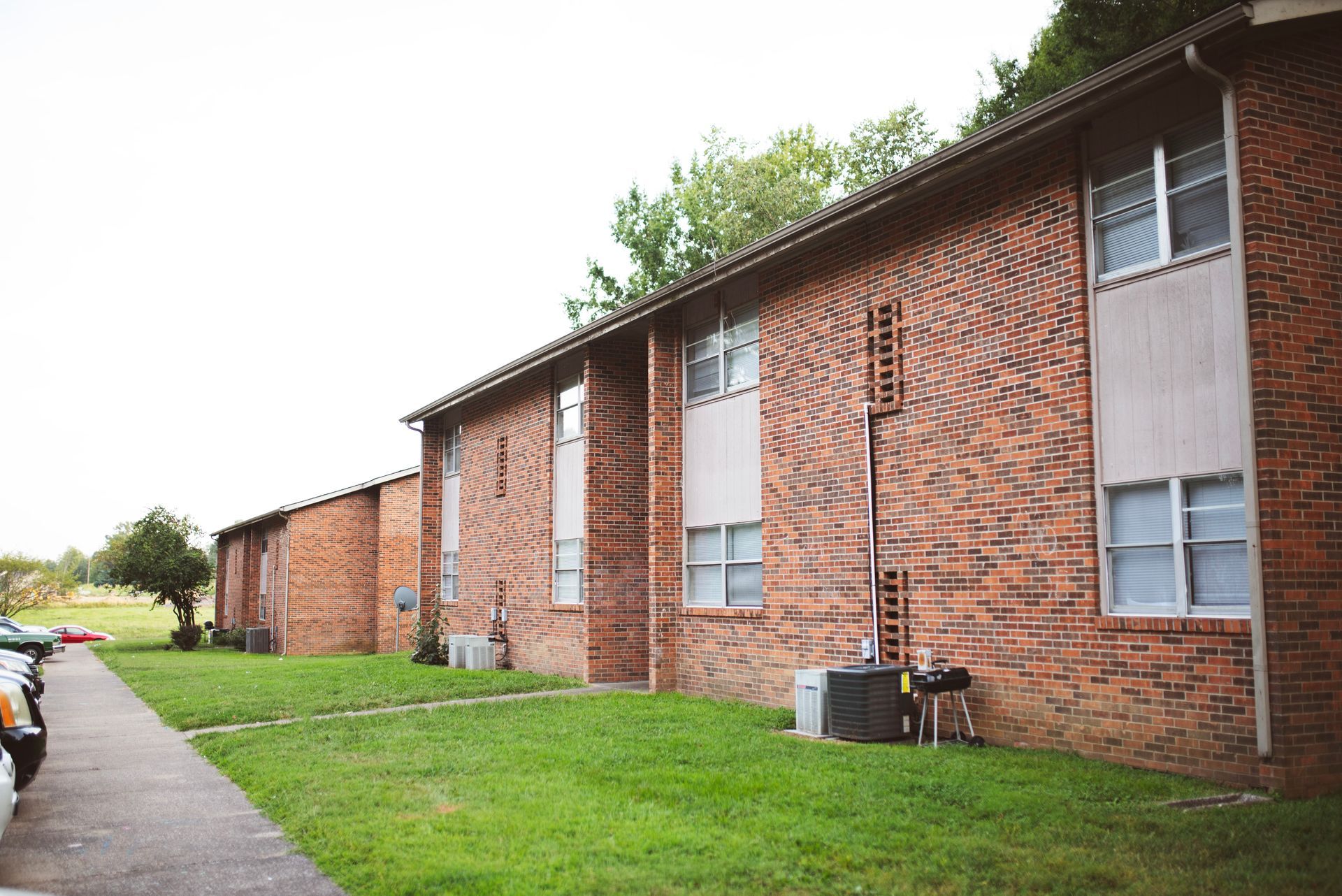 A brick apartment building with a lot of windows