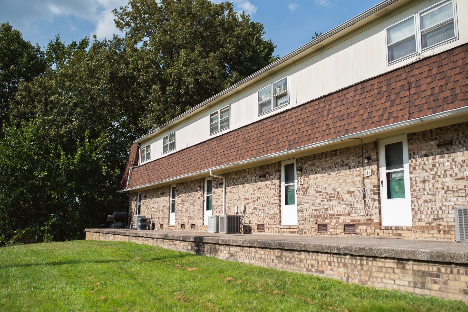 A brick building with a lot of windows and doors