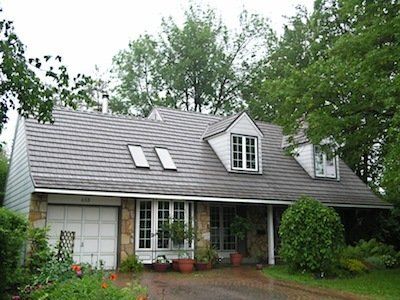 Home with rustic wood shingle roof