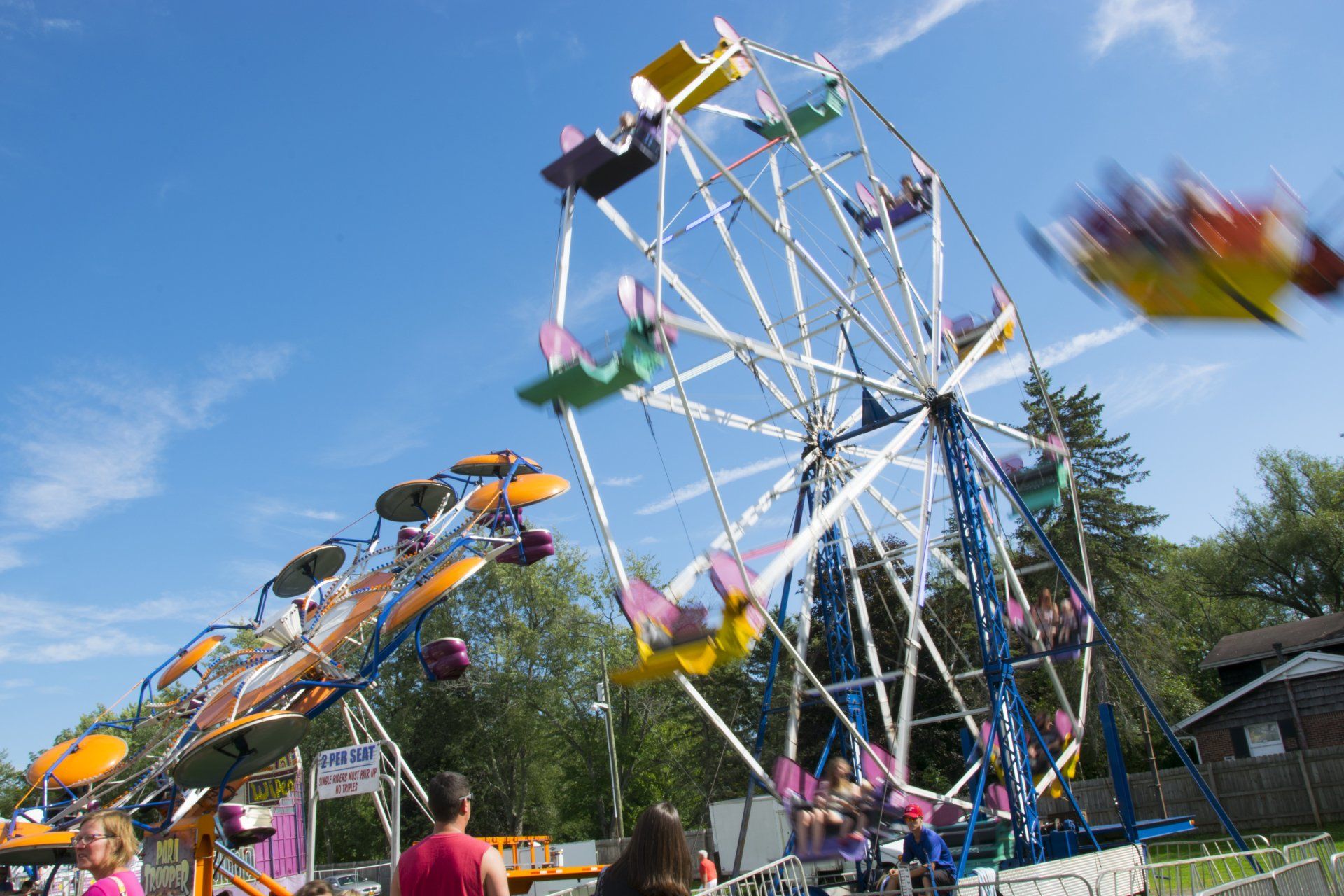 People riding a ferris wheel at an amusement park