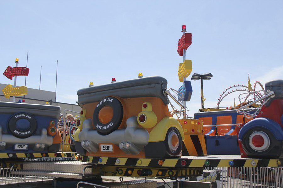 A carnival ride has a license plate that says ssp