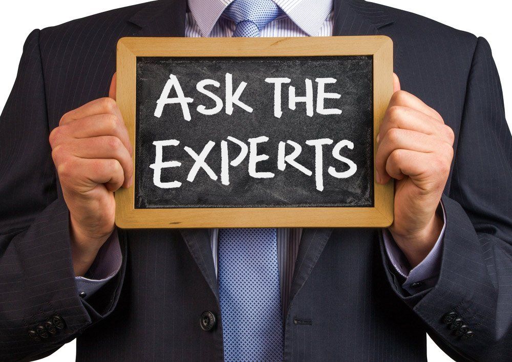 Man Holding 'Ask the Experts' Sign — Contact in Bundaberg QLD