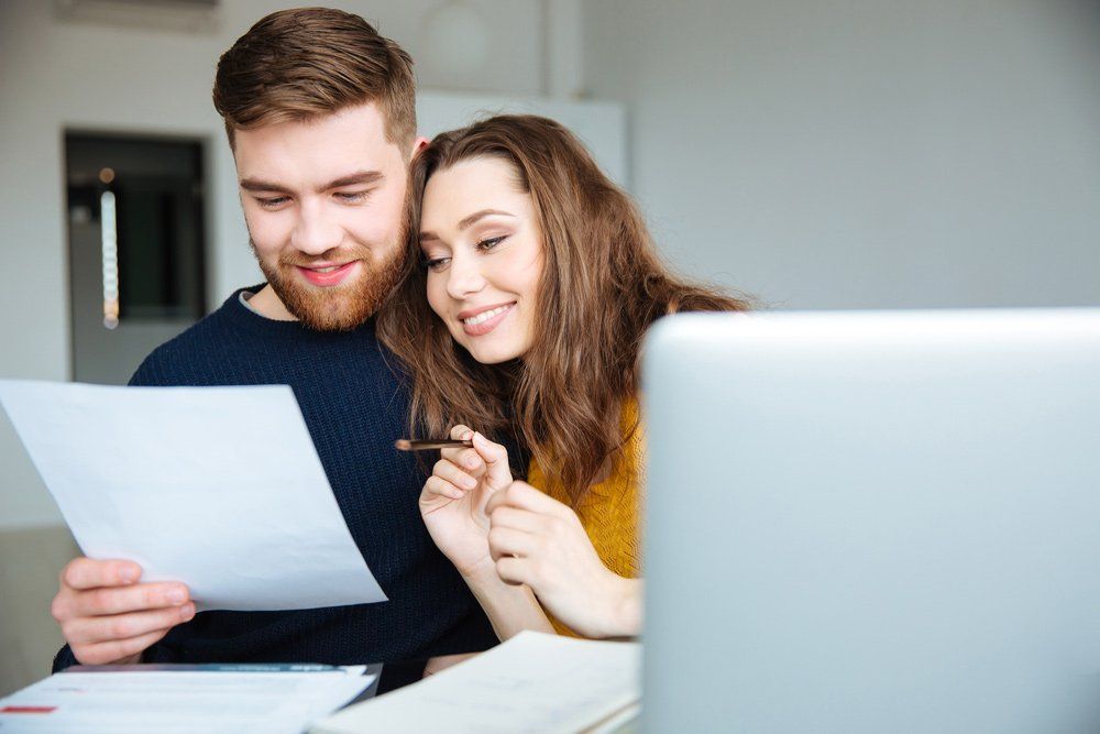Couple looking at Financial Documents — Bookkeepers in Bundaberg QLD