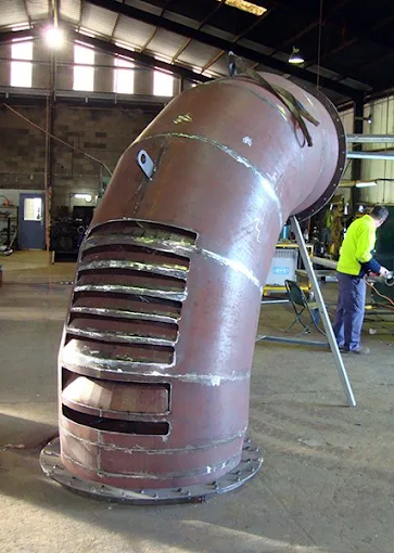 A Bunch Of Metal Pipes Stacked On Top Of Each Other In A Warehouse — Agriweld Engineering in Dubbo, NSW