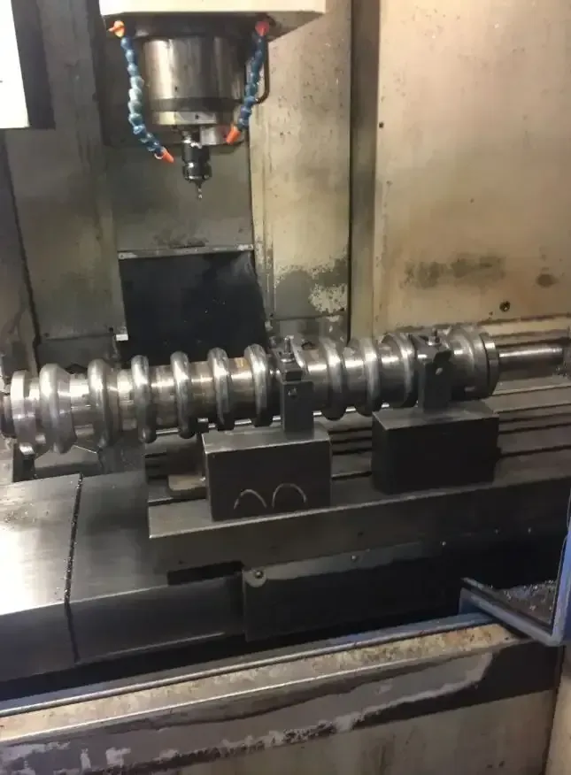 A Machine Is Cutting A Piece Of Metal On A Table — Agriweld Engineering in Dubbo, NSW