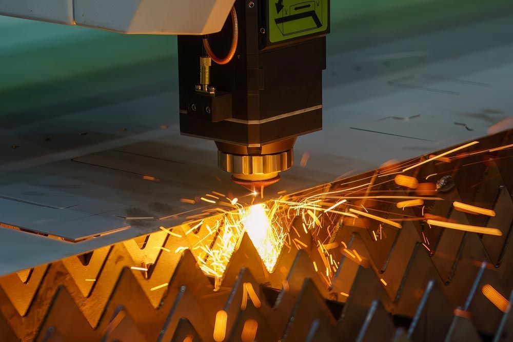 A Machine Is Cutting A Piece Of Metal With Sparks — Agriweld Engineering in Dubbo, NSW