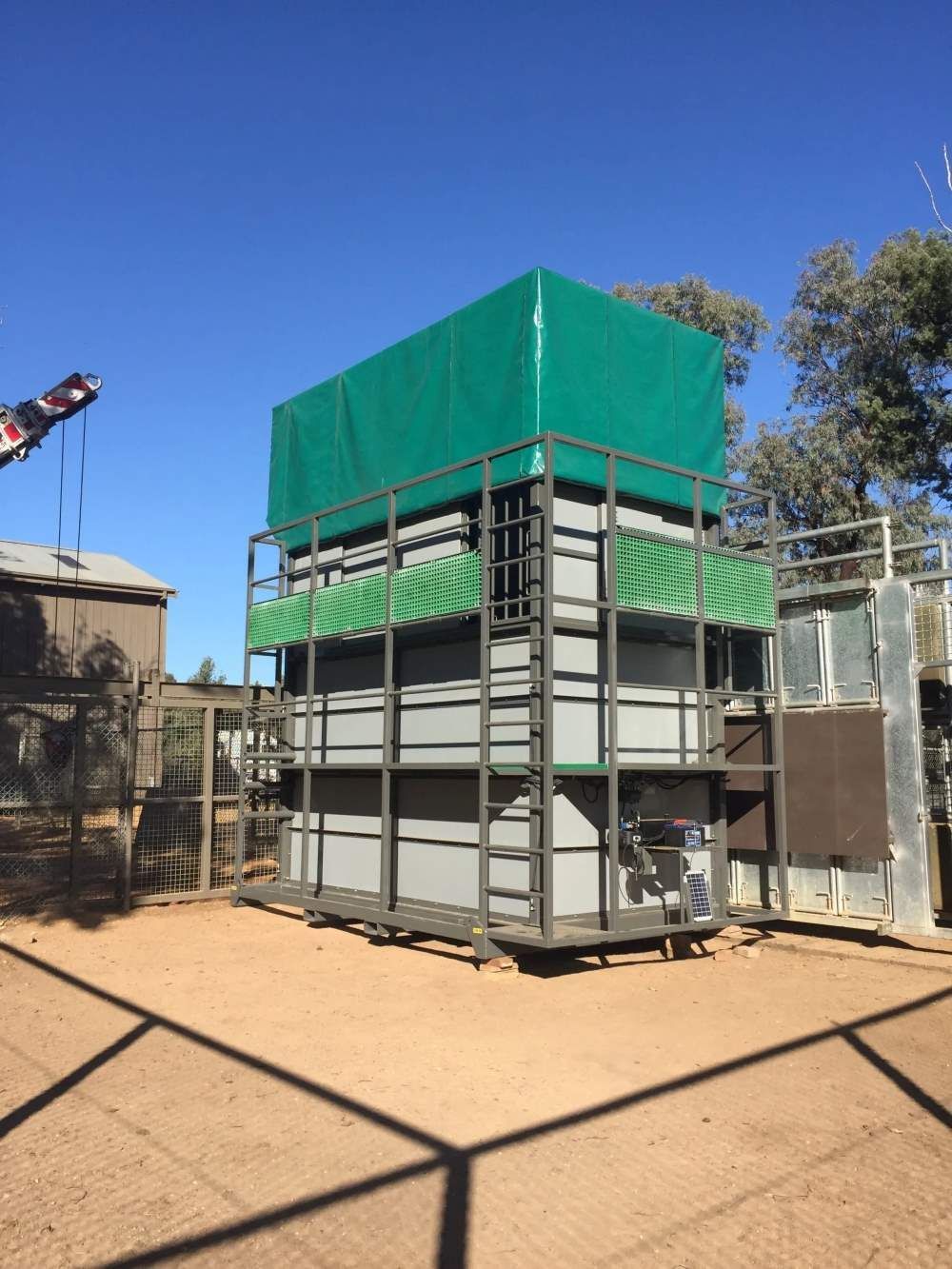 A Large Building With A Green Tarp On Top Of It — Agriweld Engineering in Dubbo, NSW