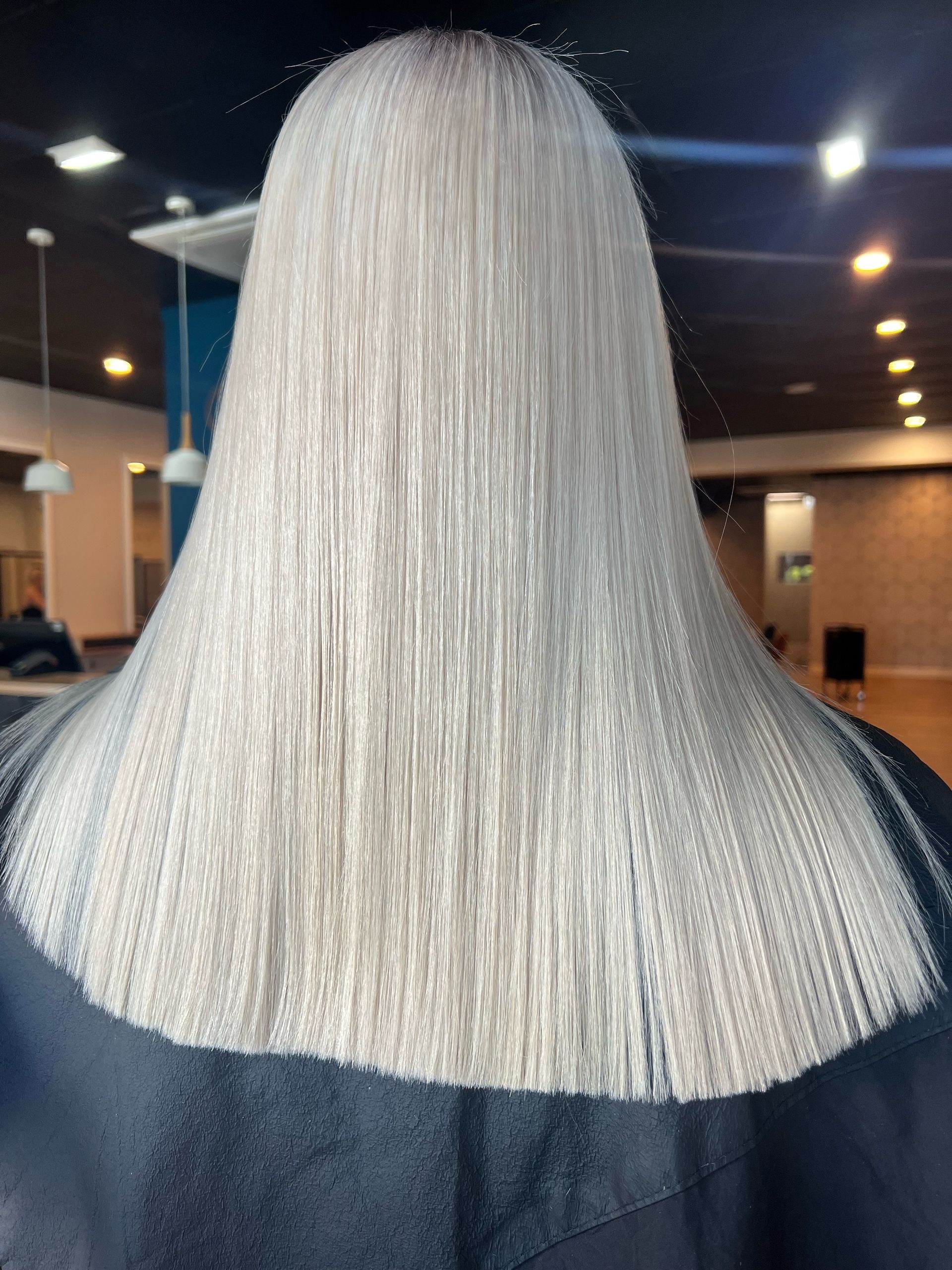 Woman With Wavy, Highlighted Hair In A Salon — Gina T Hair & Beauty In Mackay, QLD