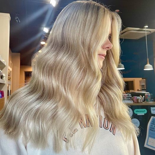 Blonde Wavy Hair Styled On A Person In A Salon, With Highlights And Dark Roots — Gina T Hair & Beauty In Mackay, QLD