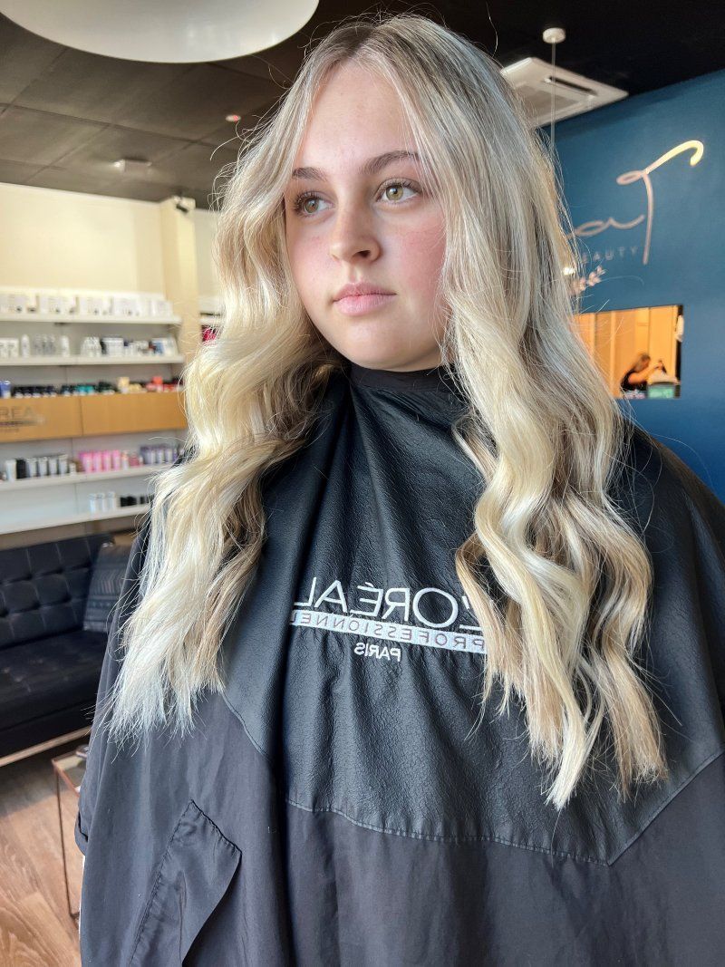 Blonde-haired Woman With Wavy Hair In A Salon — Gina T Hair & Beauty In Mackay, QLD