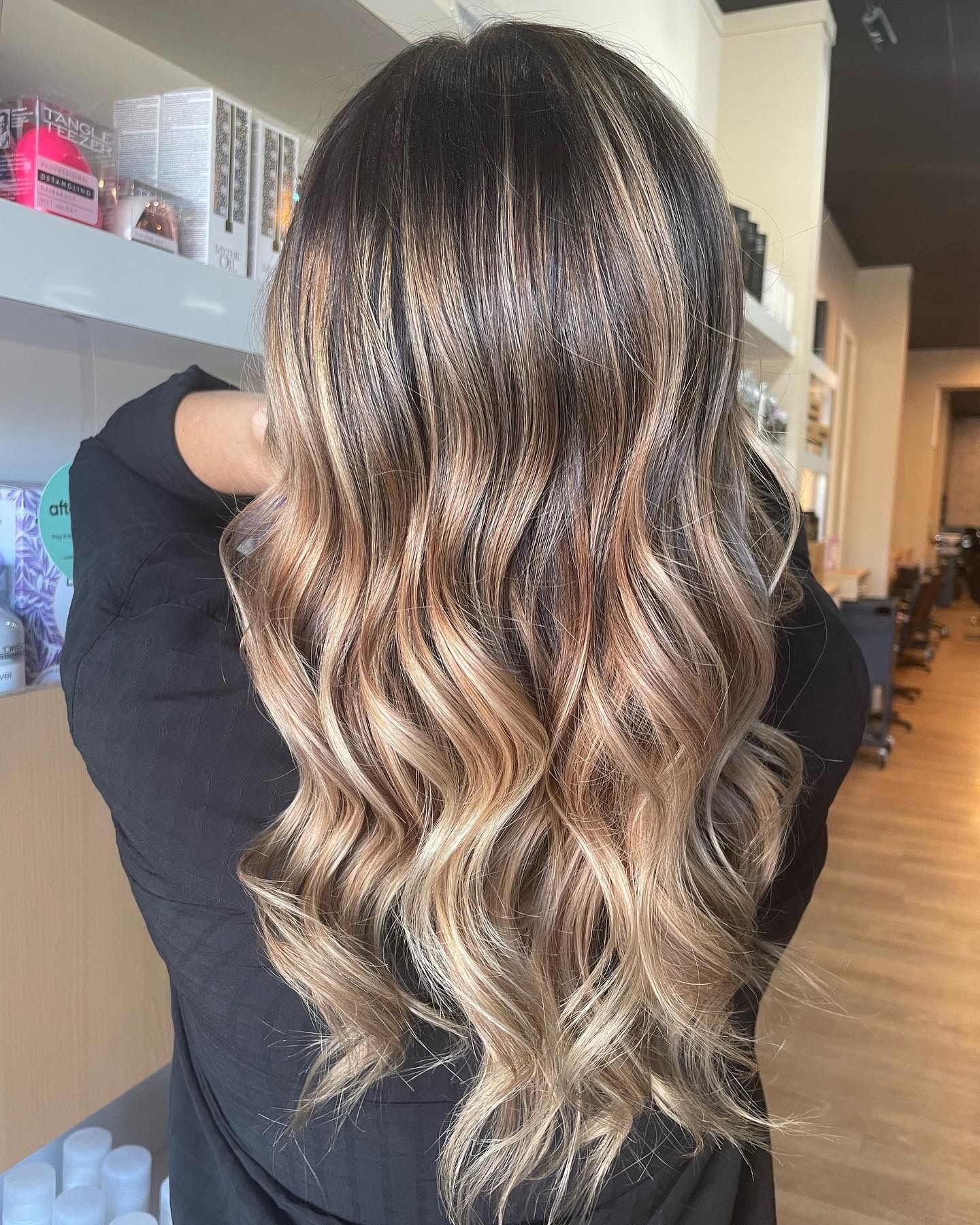 Woman With Long, Wavy Blonde Hair — Gina T Hair & Beauty In Mackay, QLD
