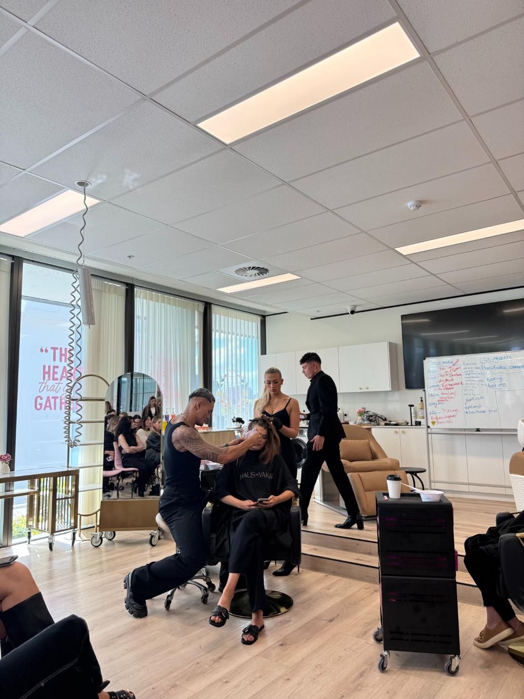 Hair Styling Class: Stylist Demonstrating on a Seated Model — Gina T Hair & Beauty In Mackay, QLD