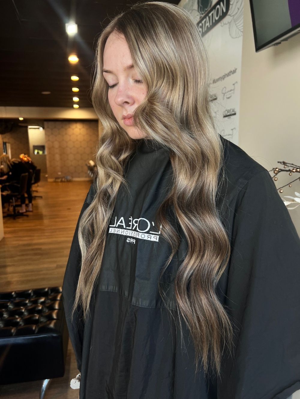 Woman With Long, Wavy, Ash-blonde Hair In A Salon — Gina T Hair & Beauty In Mackay, QLD
