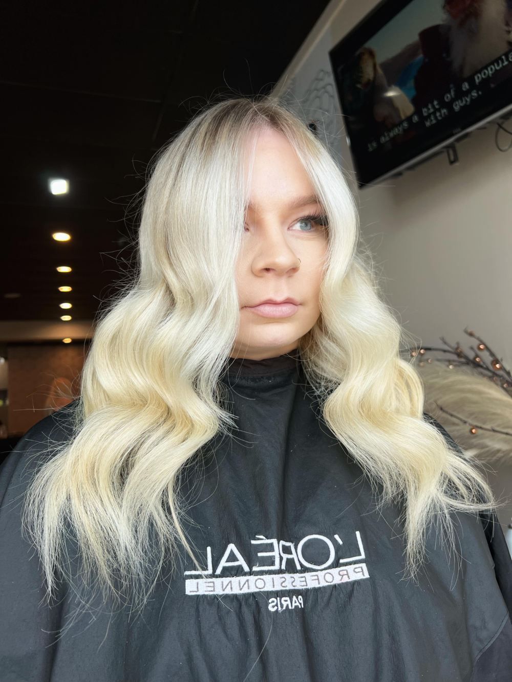 Woman With Long, Wavy, Platinum Blonde Hair At A Salon — Gina T Hair & Beauty In Mackay, QLD