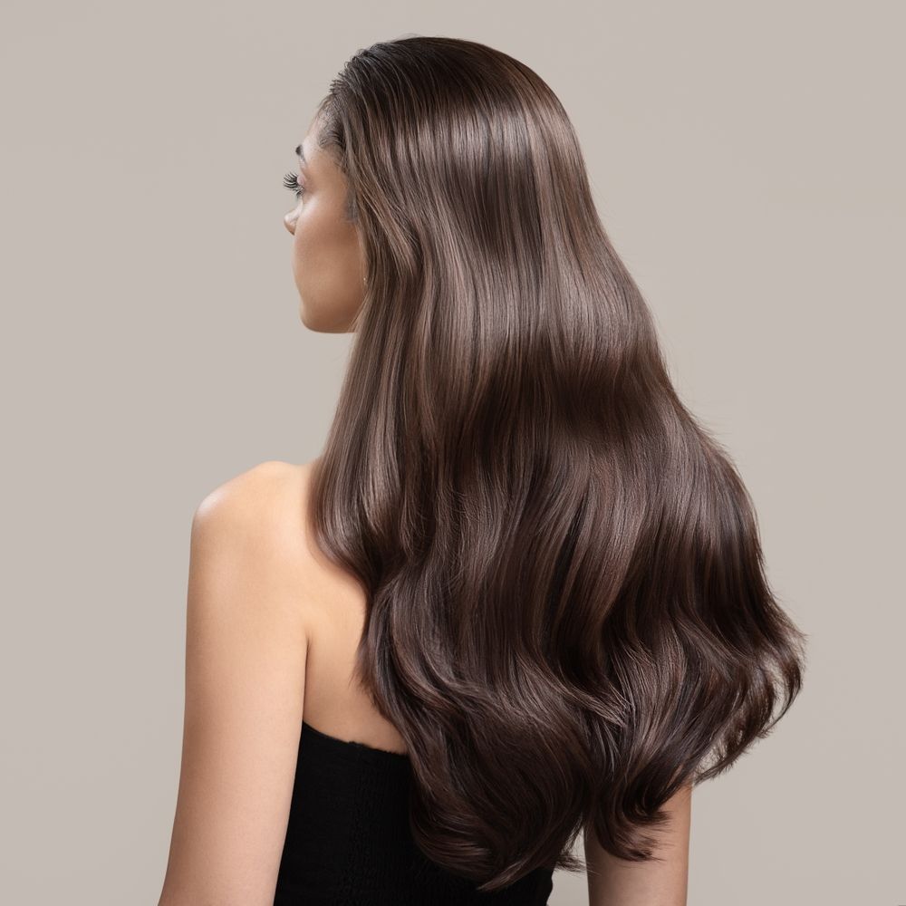 Woman With Long, Wavy, Dark Brown Hair — Gina T Hair & Beauty In Mackay, QLD