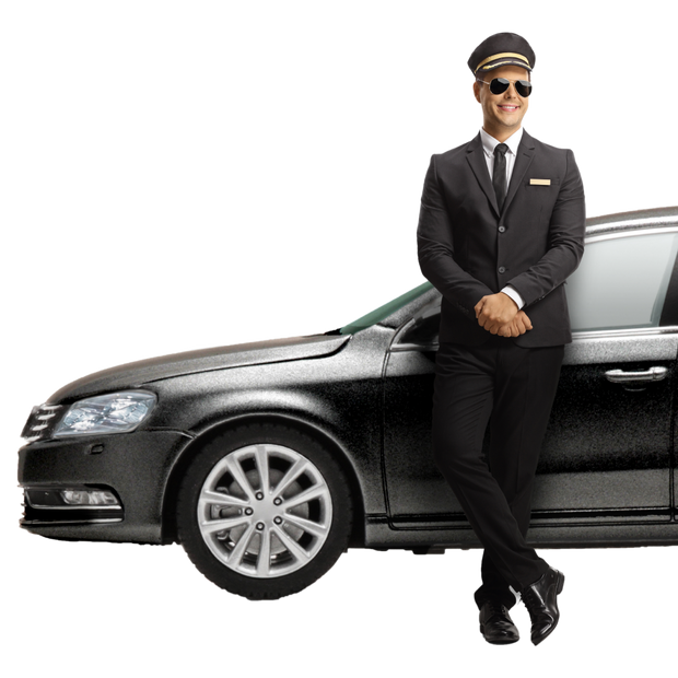 Young male professional chauffeur leaning on a black car isolated on white background
