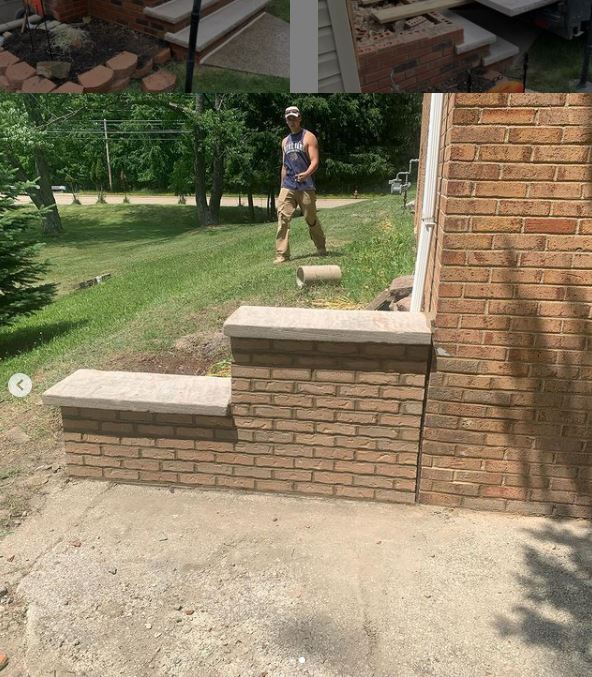 A person standing near a newly built brick structure with a concrete top, next to a brick wall. 