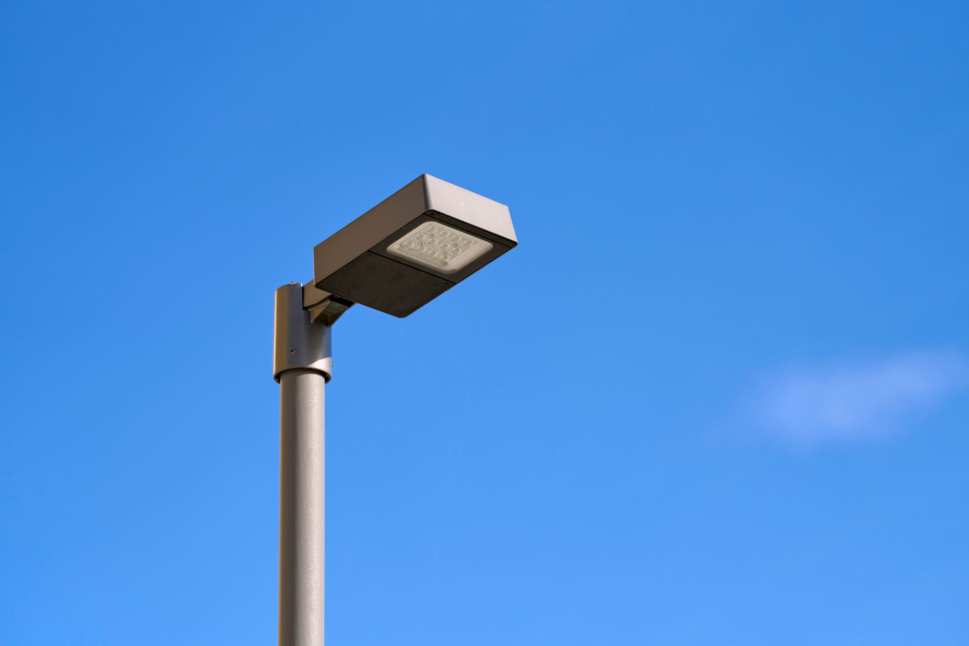 An empty parking garage with cars parked in it.