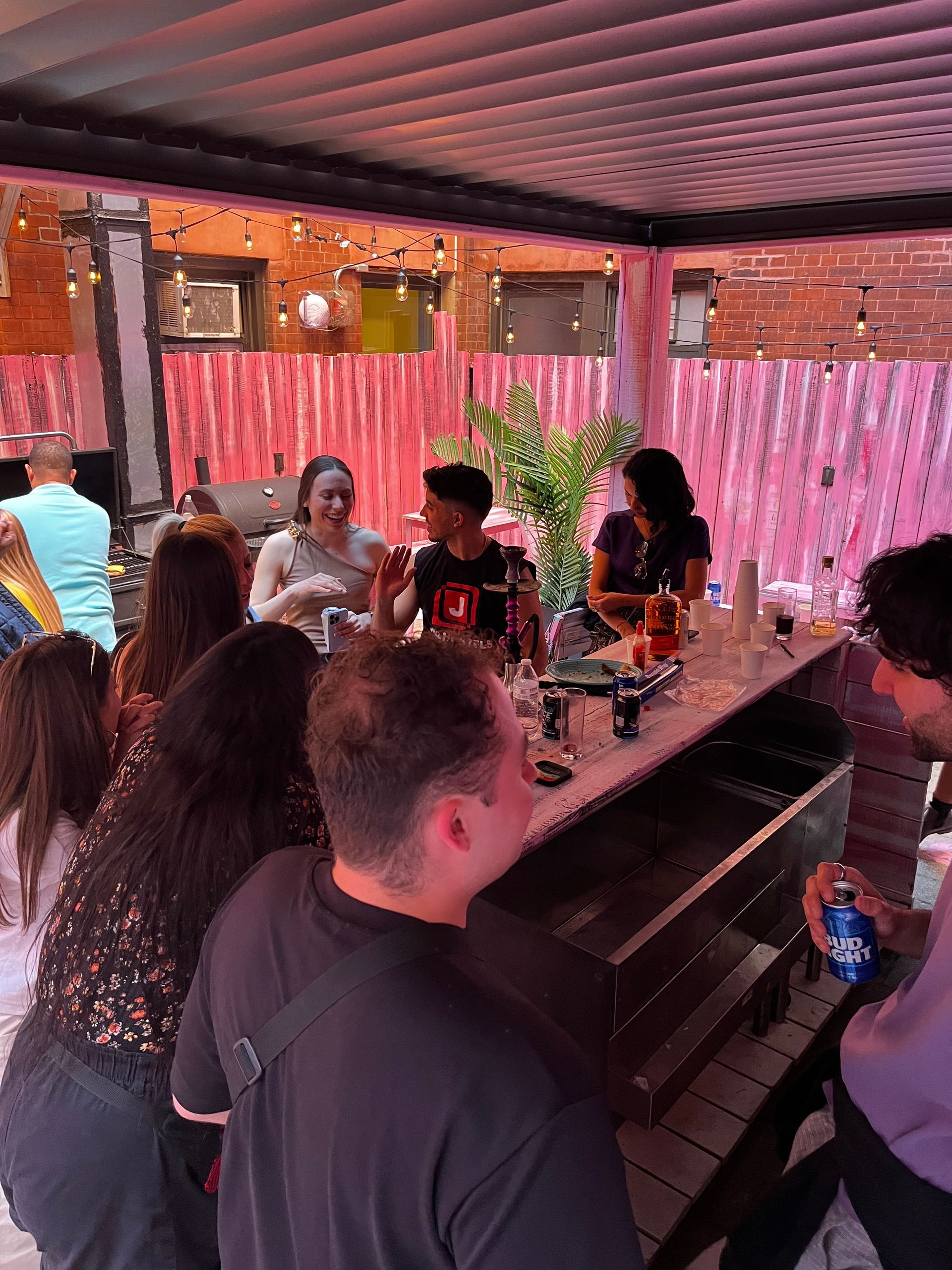 A group of people are sitting at a table in a restaurant.