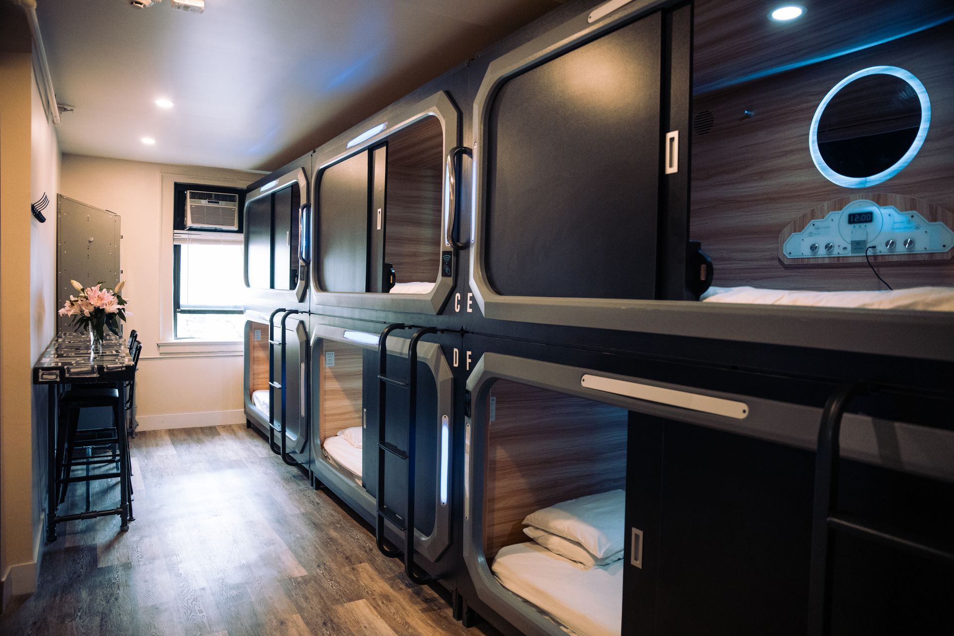 A room with a lot of bunk beds in it