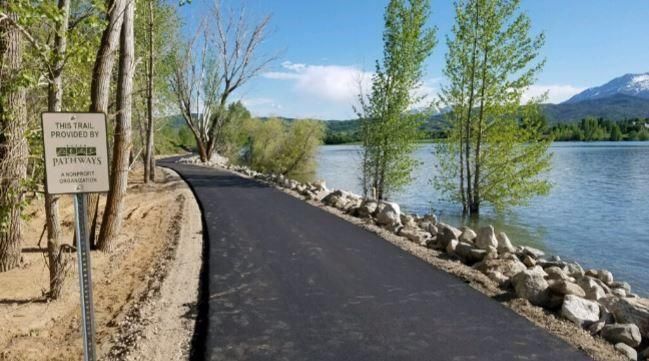 There is a sign on the side of the road that says no parking.