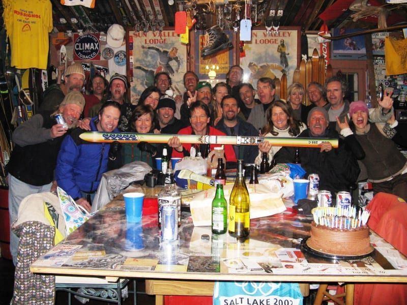 A group of people standing around a table with a sign that says salt lake 200