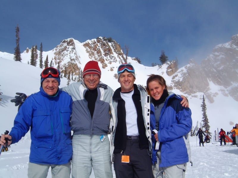 A group of people posing for a picture in the snow