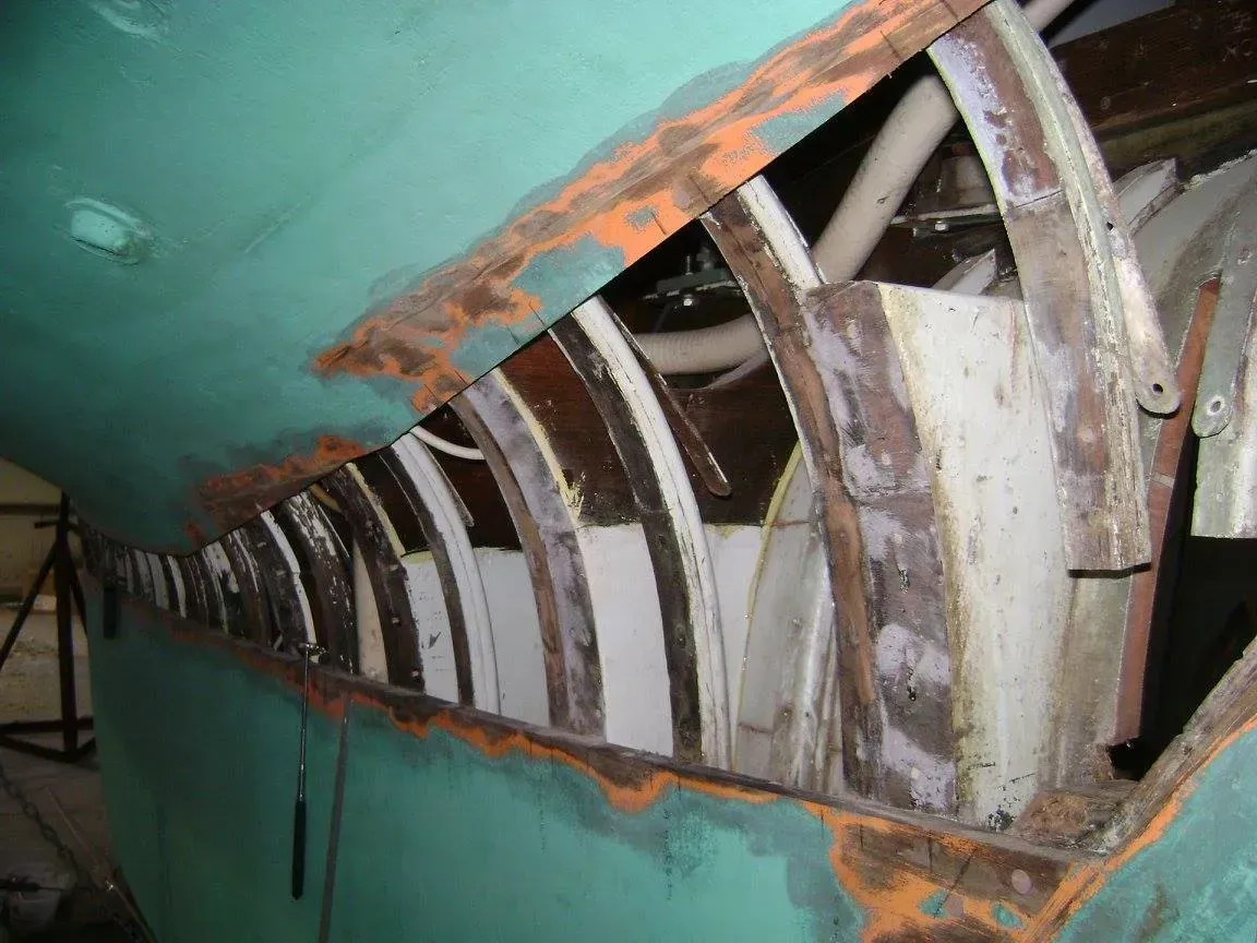 A close up of a piece of metal with rust on it