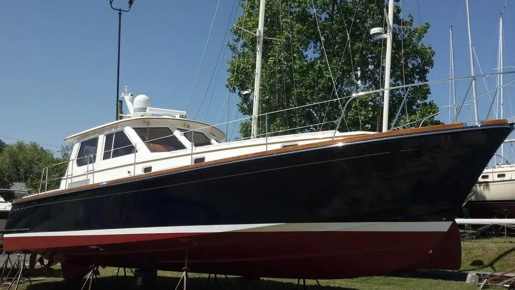 A large boat is sitting on top of a trailer.