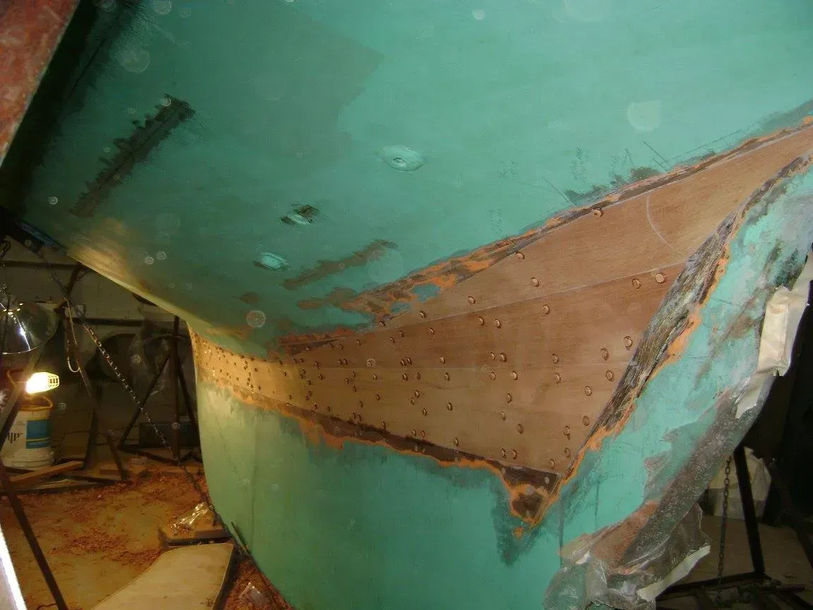 A close up of a green and brown object with a hole in it.