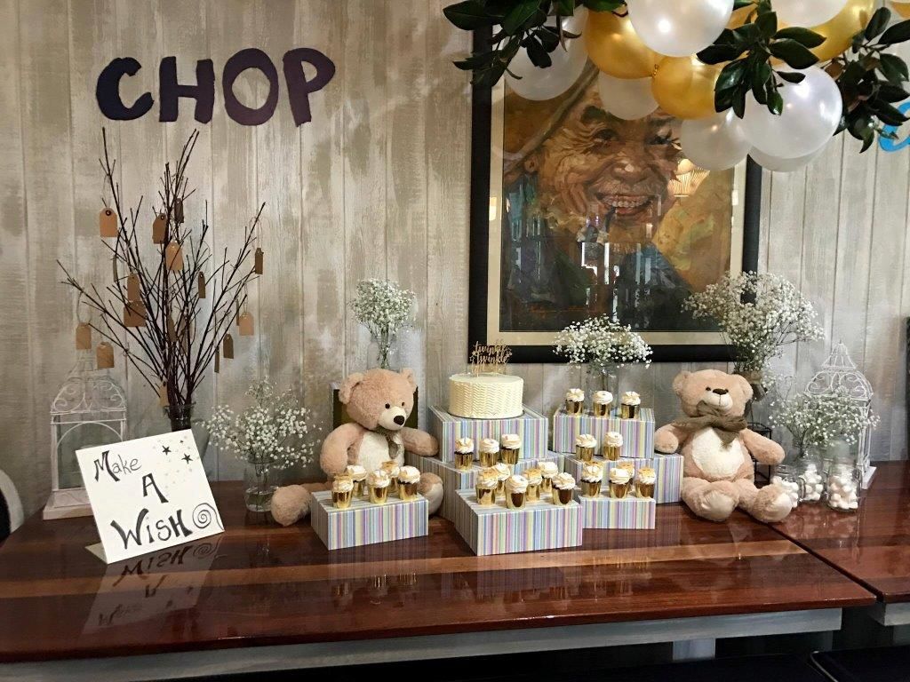 A Wooden Table with Teddy Bears and Cupcakes on It — Chop 'n Chill in Port Macquarie, NSW