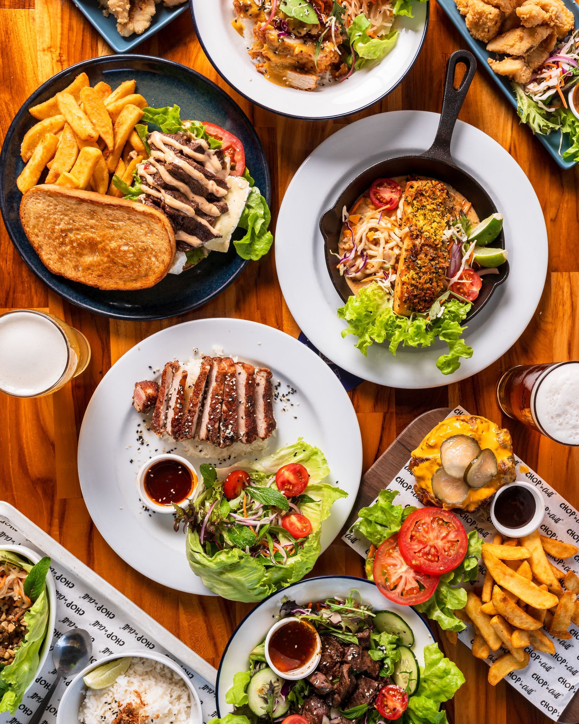 A Table With Two Drinks And Two Paintings On The Wall — Chop 'n Chill in Port Macquarie, NSW