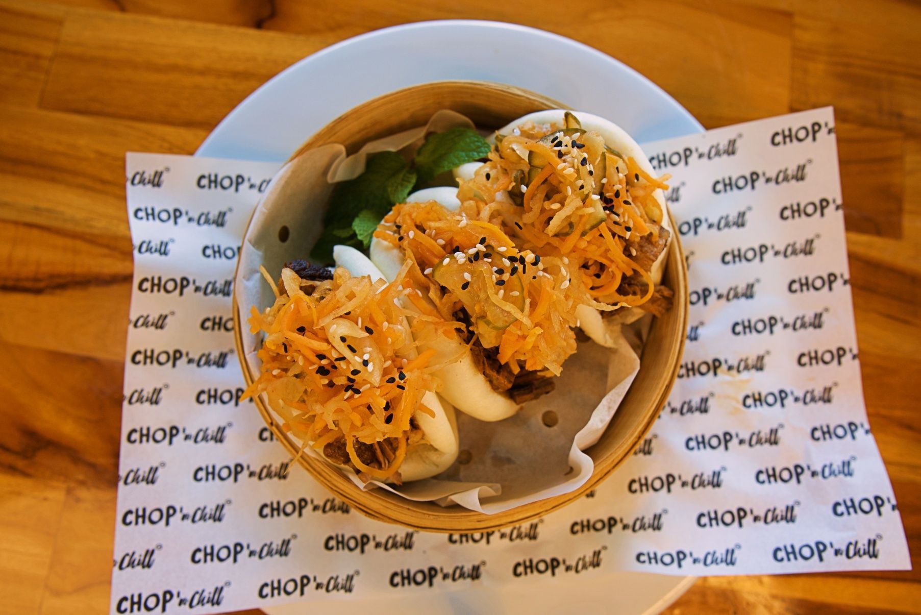 Steamed Bao Buns With Shredded Carrot Topping, in a Bamboo Steamer on Patterned Paper — Chop 'n Chill in Port Macquarie, NSW