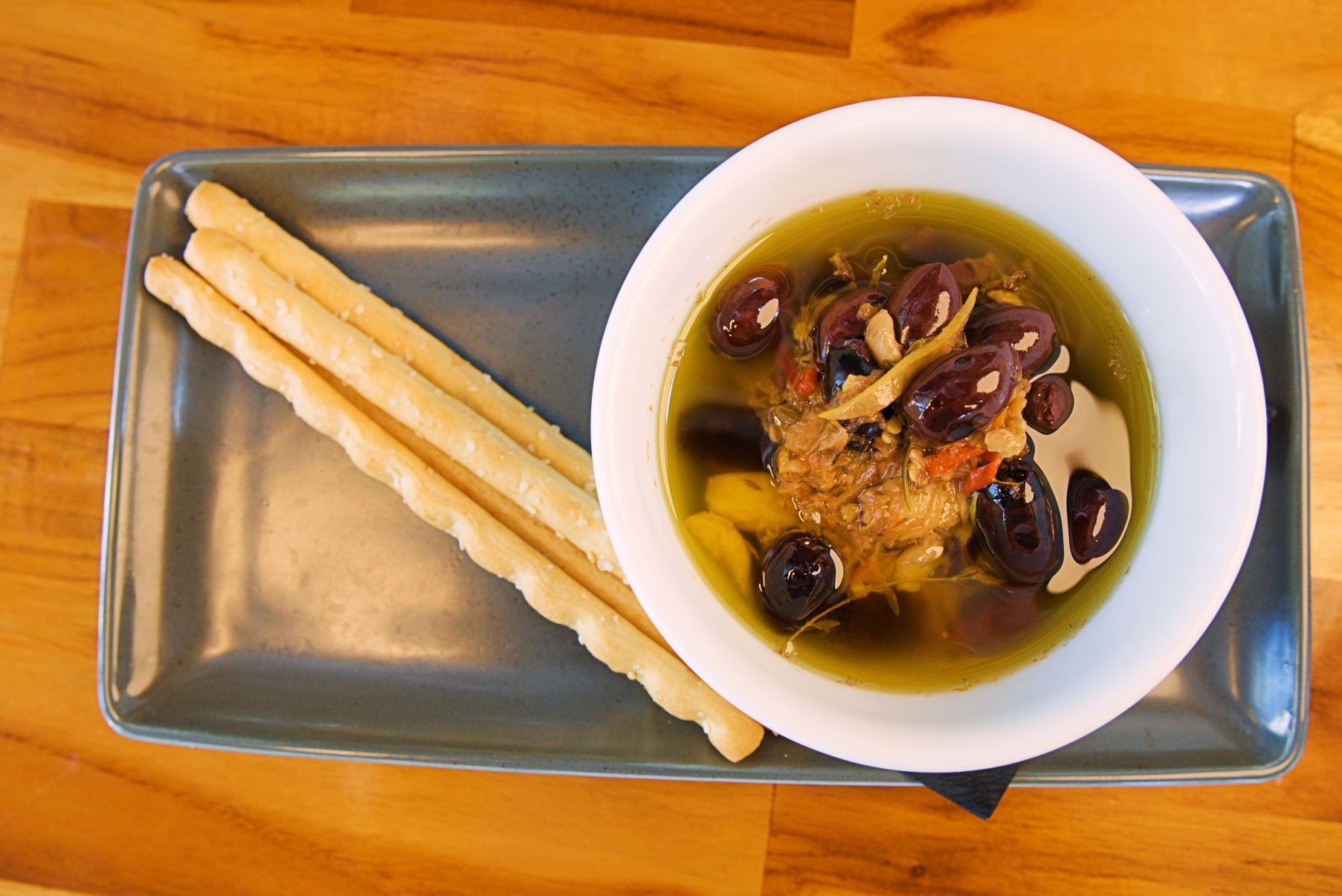 Bowl of Olives in Oil and Breadsticks on a Rectangular Plate — Chop 'n Chill in Port Macquarie, NSW