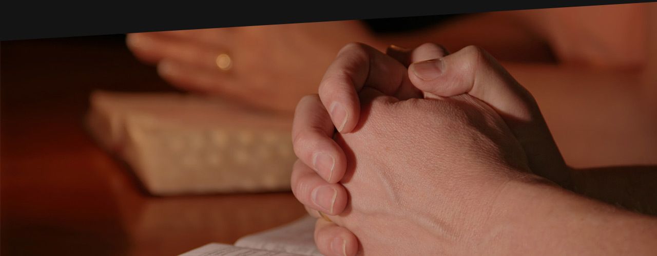 Hand on bible in a church