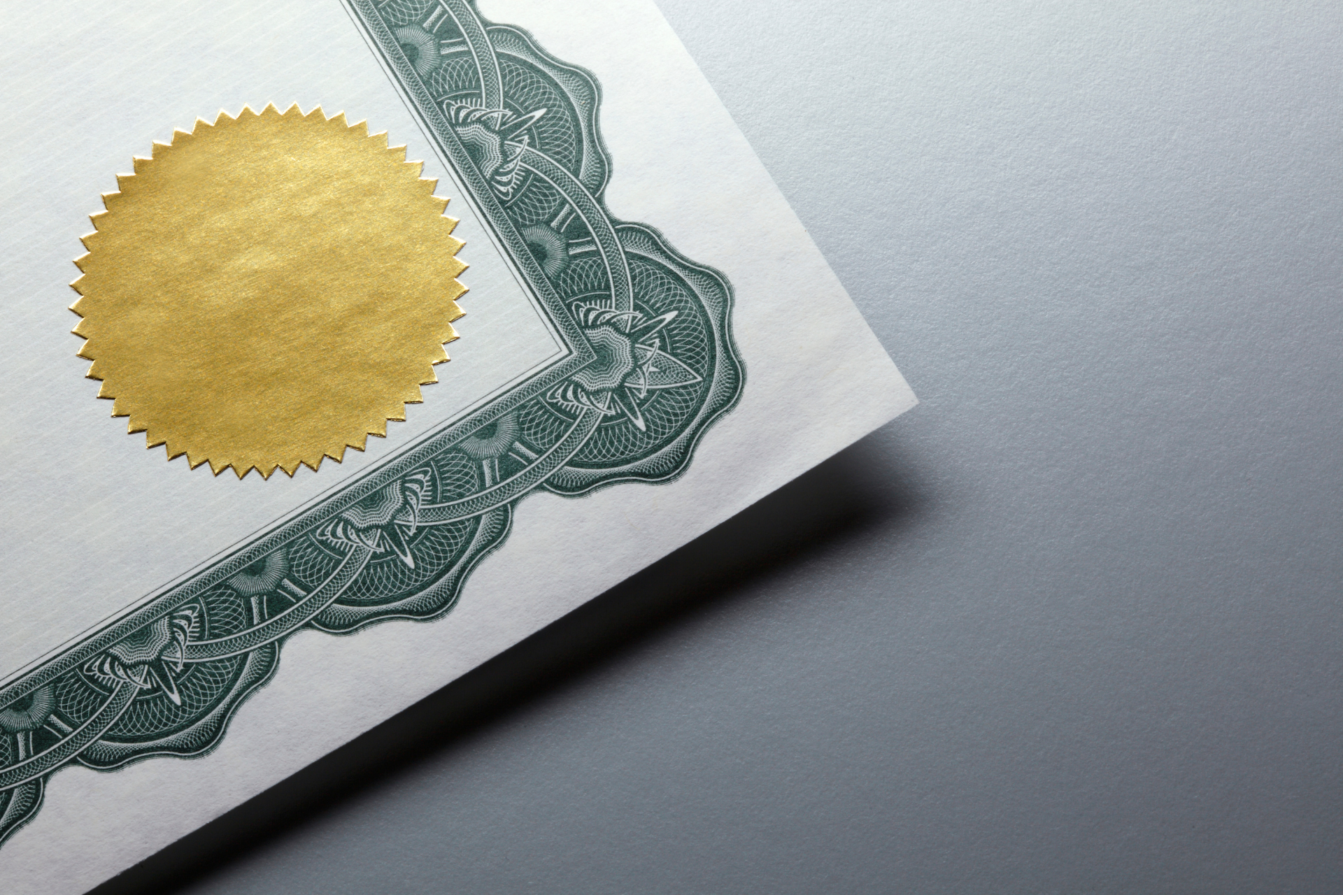 A piece of paper with a gold seal on it