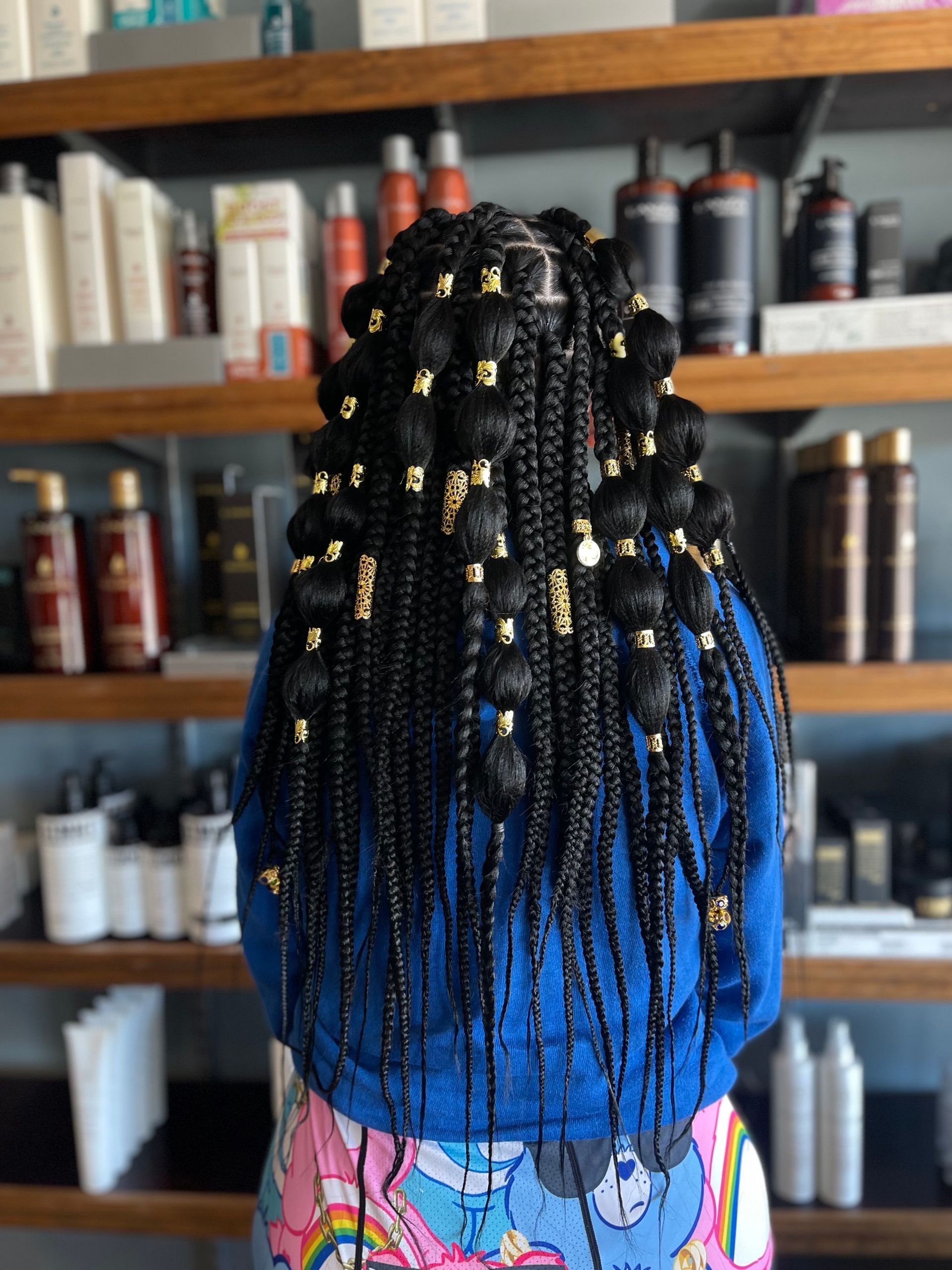 The Hurley Co. using braiding as a protective style on long hair.