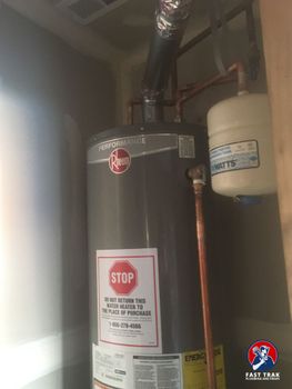 Close-up image of a gas water heater replacement in a Colorado house