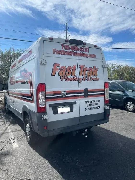 Fast Trak service van parked near at a customer's home for a Faucet Replacement service