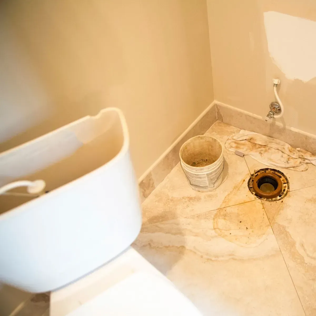 Old toilet being replaced with a new one